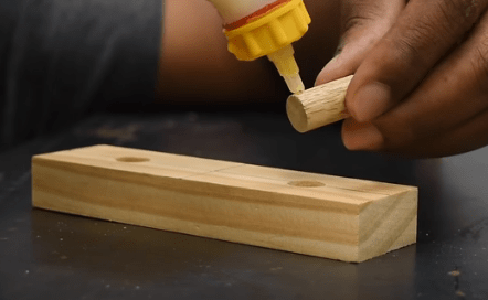 Glue on the base of the wood pin
